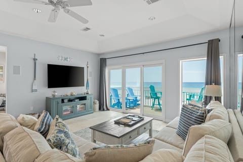 Sink into plush coastal furnishings while watching your favorite shows, then step onto your private balcony for endless ocean views.