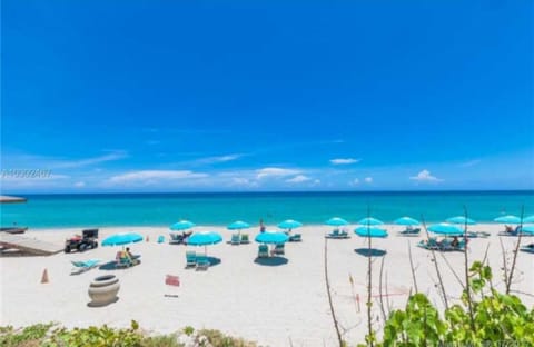 Complementary beach service with umbrellas and lounge chairs.