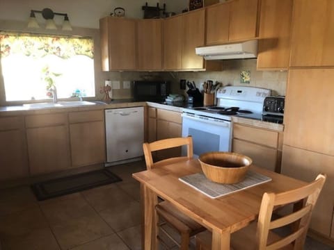 Full Service Kitchen with double sink, pantry and Laundry Room to left