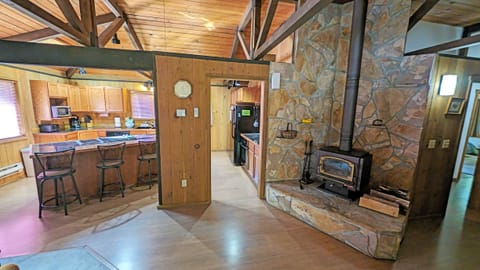 Left of the front door, wood burning wood stove, kitchen