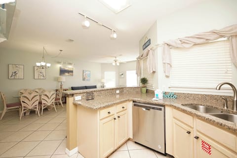 Your open-concept kitchen flows seamlessly into the living space, featuring granite countertops and modern appliances for effortless meal prep.