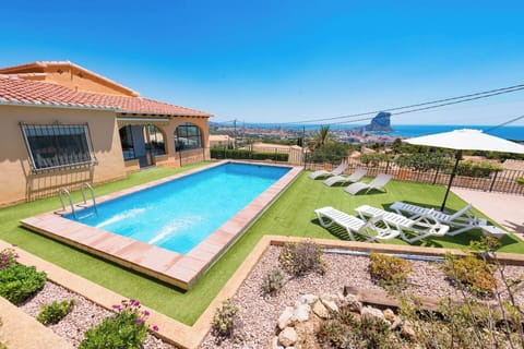 Pleasant holiday villa with private pool and stunning sea views, located in Calpe (COSTA BLANCA) for 8 people. The villa has four bedrooms and three bathrooms distributed over two floors.INTERIOR: This beautiful villa has air conditioning, is composed of two floors connected by external stairs. On the GROUND FLOOR, we will find a bedroom with two single beds and an en suite bathroom with shower. The UPPER FLOOR, consists of a large covered terrace with views of the sea and the pool, with access to living room with Sat / Tdt TV, well-equipped independent kitchen, with mixed kitchen (gas and electric), three large bedrooms (two of them with two single beds in each and one with double bed and en suite bathroom with shower) and finally, a bathroom with bathtub.EXTERIOR: Large closed and wooded plot with pool area with spectacular views where you can enjoy the sun and delicious barbecues. Parking for 2-3 cars.LOCATION: Enjoy the tranquility just one step away from all services: only 2km separate it from the center of Calpe and its supermarkets and 2.5km from the sandy beaches.OBSERVATIONS: Wifi included. Pets are allowed up to 12kg with supplement.
