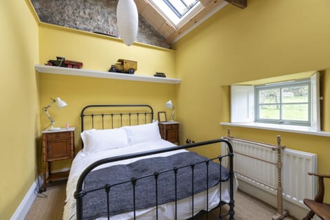 Overthwarts Farmhouse - bedroom one with single bed and stargazing Velux window above