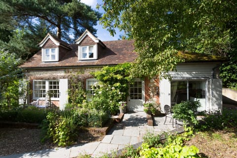 Coach House is a recently converted detached Kent ragstone coach house set in a quiet private position with views across gardens, paddock, and farmland