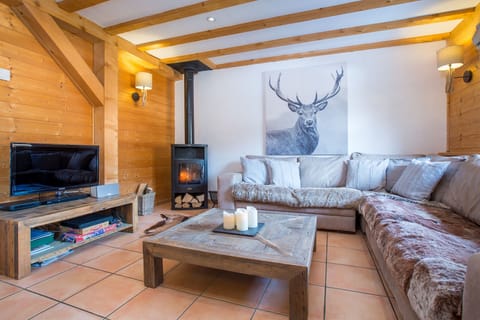 Cozy fireside lounge with wood burner.