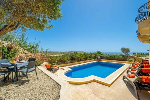 Pool area of Dar il-Bahar holiday home in Gozo