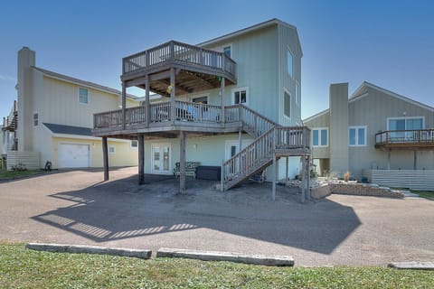 Spacious beach house with multiple levels, wrap-around decks, and convenient parking for your coastal getaway.
