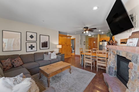 Unwind in your cozy living space with plush seating, warm fireplace, and modern entertainment for perfect mountain getaway evenings.