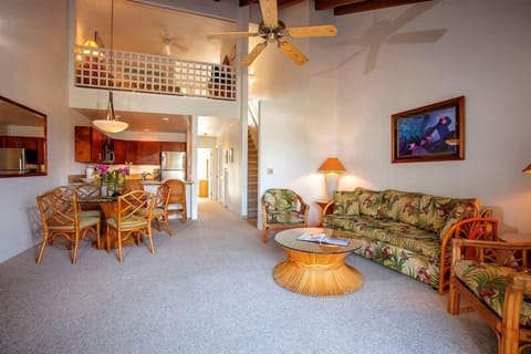 Relax in your spacious, light-filled retreat, where tropical-inspired furnishings, soaring ceilings, and a breezy loft create a comfortable island-style escape. Your perfect home base awaits.