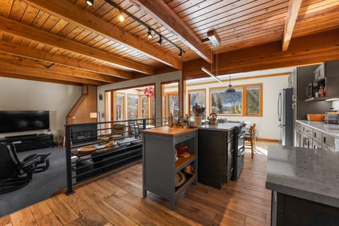 Full size kitchen with stainless steel appliances and granite countertops.