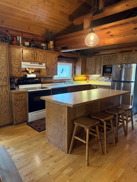 Large kitchen island with 4 stools