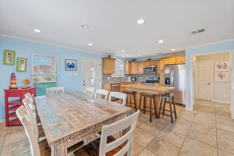 Gather around our spacious rustic wooden dining table and enjoy memorable meals with family and friends.