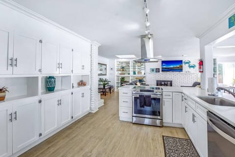 Bright, white kitchen with all the tools for home cooking