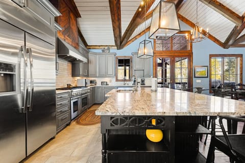 Full size kitchen offering stainless steel appliances and granite countertops.