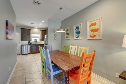 Indoor - Quaint dining space with beach-themed artwork - Dining Table Seating for 7