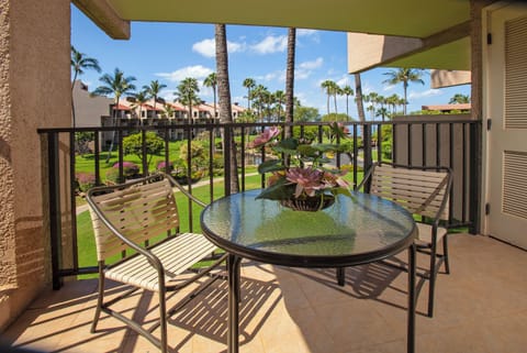 Step onto your private lanai and soak in sweeping views of lush gardens and swaying palms. The perfect spot for morning coffee or evening relaxation, where island breezes make every moment feel effortless.