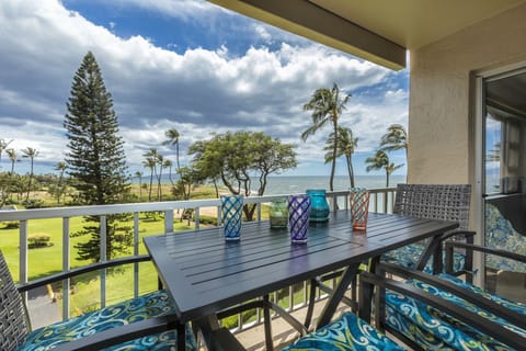 Step onto your private balcony and soak in stunning ocean and garden views with palm trees swaying. Enjoy morning coffee or sunset drinks at your outdoor dining table.