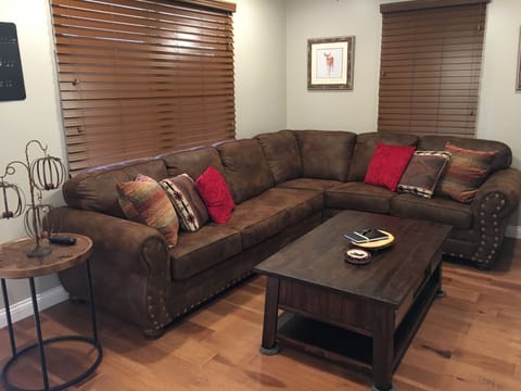 Living room area with sectional sleeper sofa.  55 inch flat screen with DISH