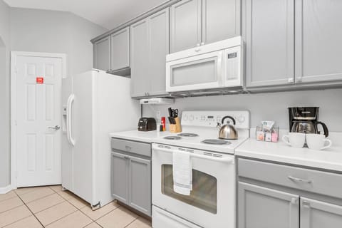 Enjoy the convenience and elegance of our fully equipped, spacious modern kitchen