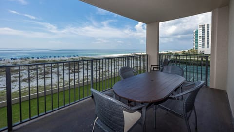 Enjoy meals at the patio table while taking in the calming views of the water and beach from your balcony