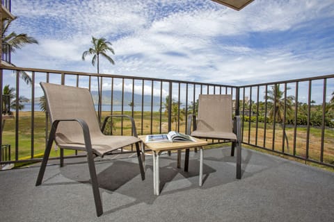 Relax on your private balcony with sweeping ocean and mountain views—perfect for morning coffee or watching sailboats drift across the bay.