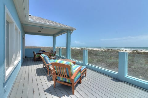 Unwind on this oceanfront deck with comfortable seating and endless sea views stretching to the horizon.