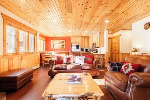 Open Concept Living Area with Leather Queen sofa sleeper