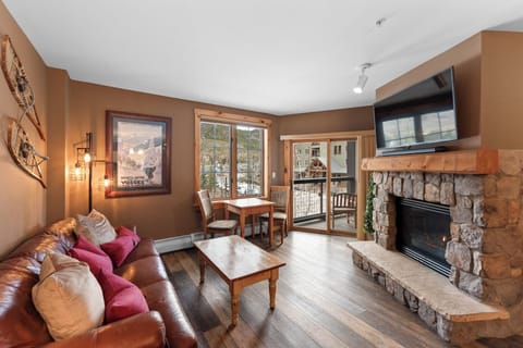 Cozy up by the stone fireplace while snow falls outside your mountain retreat windows.