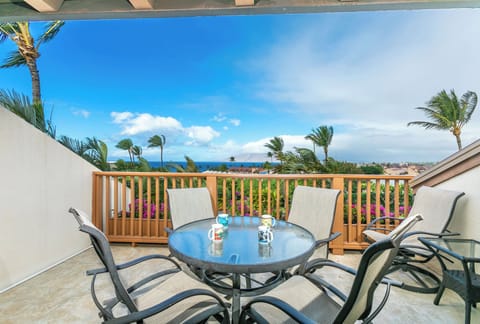 Picture yourself sipping morning coffee at this inviting table, surrounded by swaying palms and ocean breezes. Your private lanai offers stunning sea views and the perfect spot to unwind after island adventures.