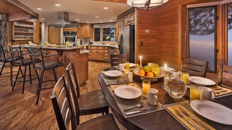 Dining area seats 8 with extra seating at kitchen bar and breakfast nook.