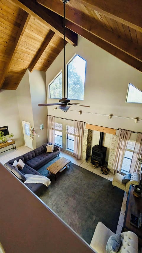 High vaulted ceilings in the living room area create a bright space to relax