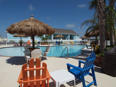 Cabanas by the pool - Enjoy the sunshine and sea breeze at this vibrant coastal pool area