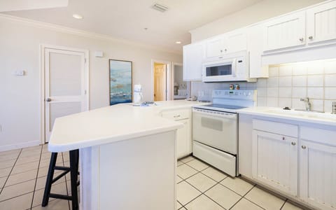 Prepare meals in this bright kitchen with ample counter space and a welcoming atmosphere for family gatherings