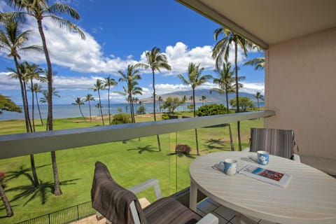 Sip your morning coffee from your private balcony, overlooking swaying palms, emerald lawns, and stunning ocean views with distant island silhouettes framing the horizon.