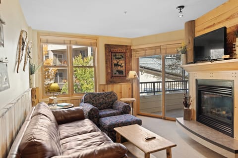 Sink into plush leather seating by your cozy fireplace, where rustic charm meets modern comfort in this inviting mountain retreat.