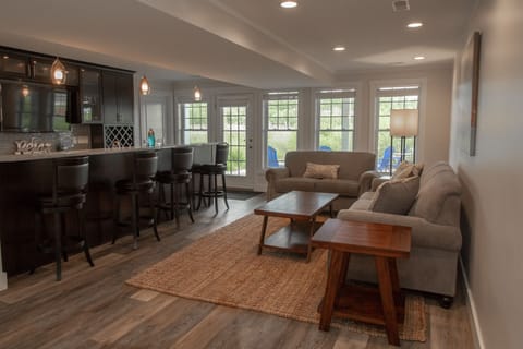 Garden Level | Living Room - Basement with Fully Stocked Bar and Walk Out to Fire Pit