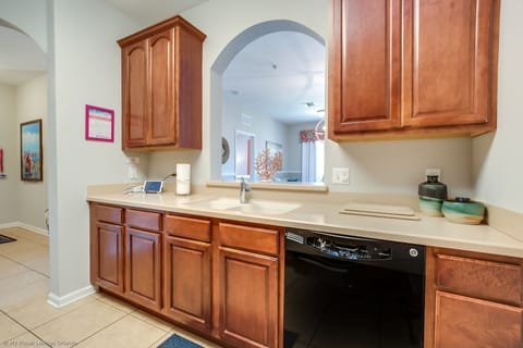 The kitchen combines style and functionality, offering guests a contemporary space to unleash their culinary creativity and enjoy the comforts of home during their stay.