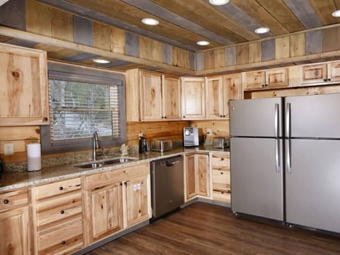 The kitchen has granite countertops and two sets of slate appliances