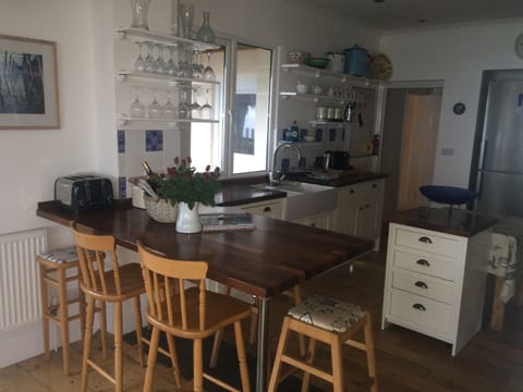 View to the kitchen over the breakfast bar: 2 ovens, MW, DW, WM, double sink, FF