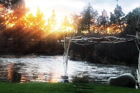 Golden sunset light over peaceful river views creates a calm, scenic, and relaxing retreat.