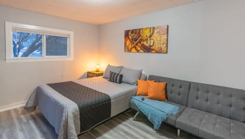 Large queen sized bed with a futon bed that can also be made into a bed