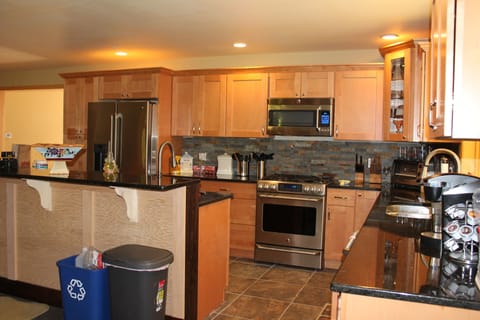 Granite countertops and Center island with additional sink for cooking prep