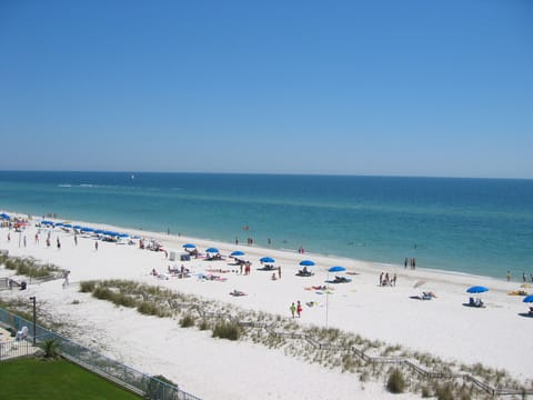 Grab a lounger and an umbrella from the beach boy and chill
