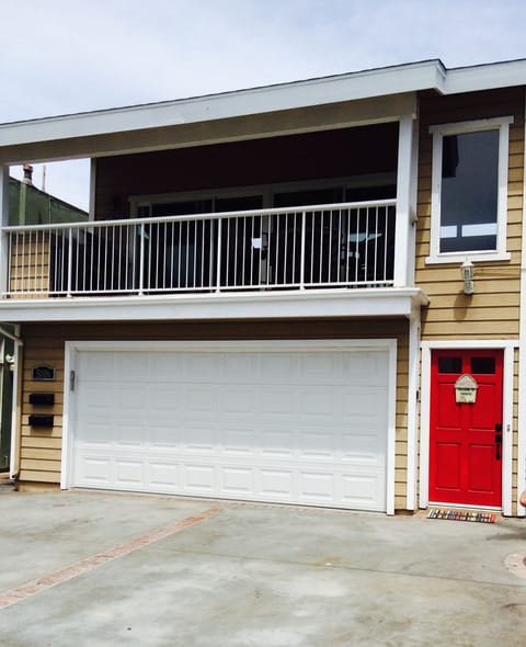 View of the front of the property. Red door is upstairs listing #63877.