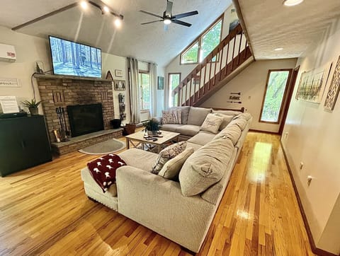 Large comfy sofa for gathering in front of the fireplace.