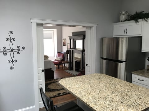 Large granite island to eat on, or use as a workspace with free wifi!