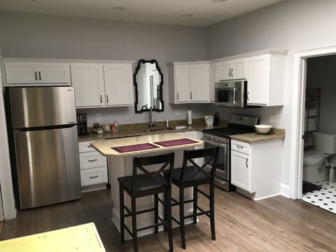 Full kitchen with gas range and granite countertops!
