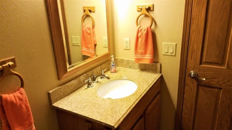 All Baths have custom tile, oak cabinetry and solid granite counters.  Nice!