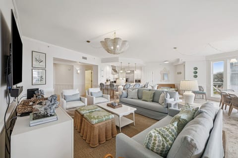 Sink into plush seating surrounded by coastal elegance, where soft textures and breezy hues invite you to relax in your light-filled retreat.