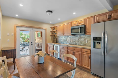 Primary suite kitchen (refrigerator, microwave and Bosch dishwasher). No oven.